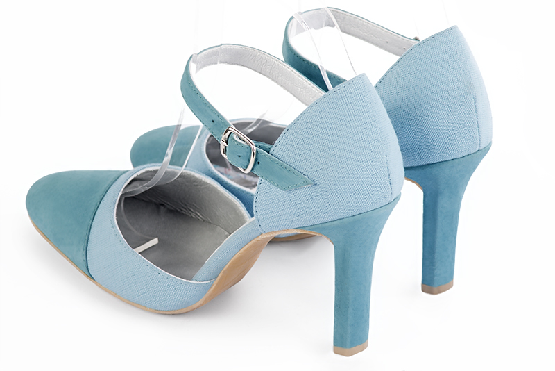 Sky blue women's open side shoes, with an instep strap. Round toe. Very high slim heel. Rear view - Florence KOOIJMAN